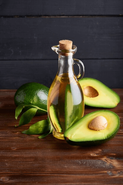 Oil bottle with avocados